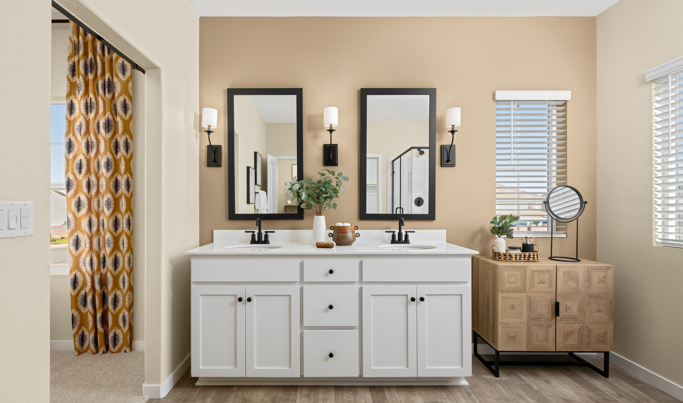 Primary bath with vanity and tile flooring