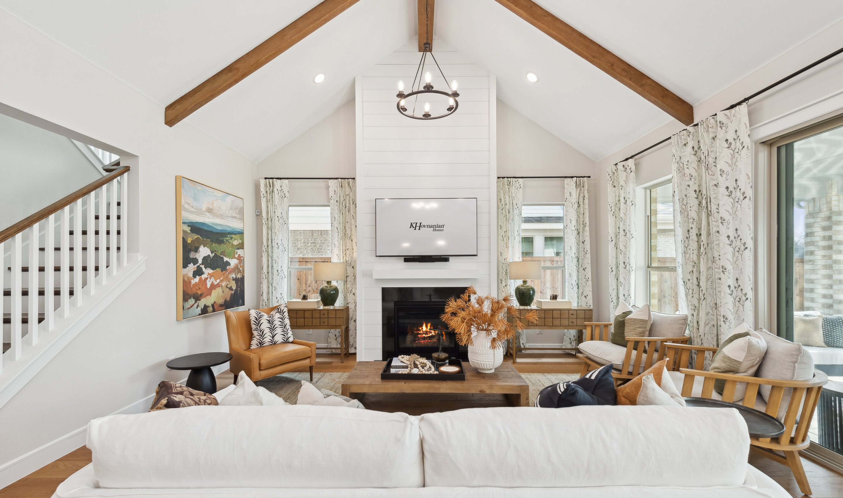 Great room with stained ceiling beams and vaulted ceiling 