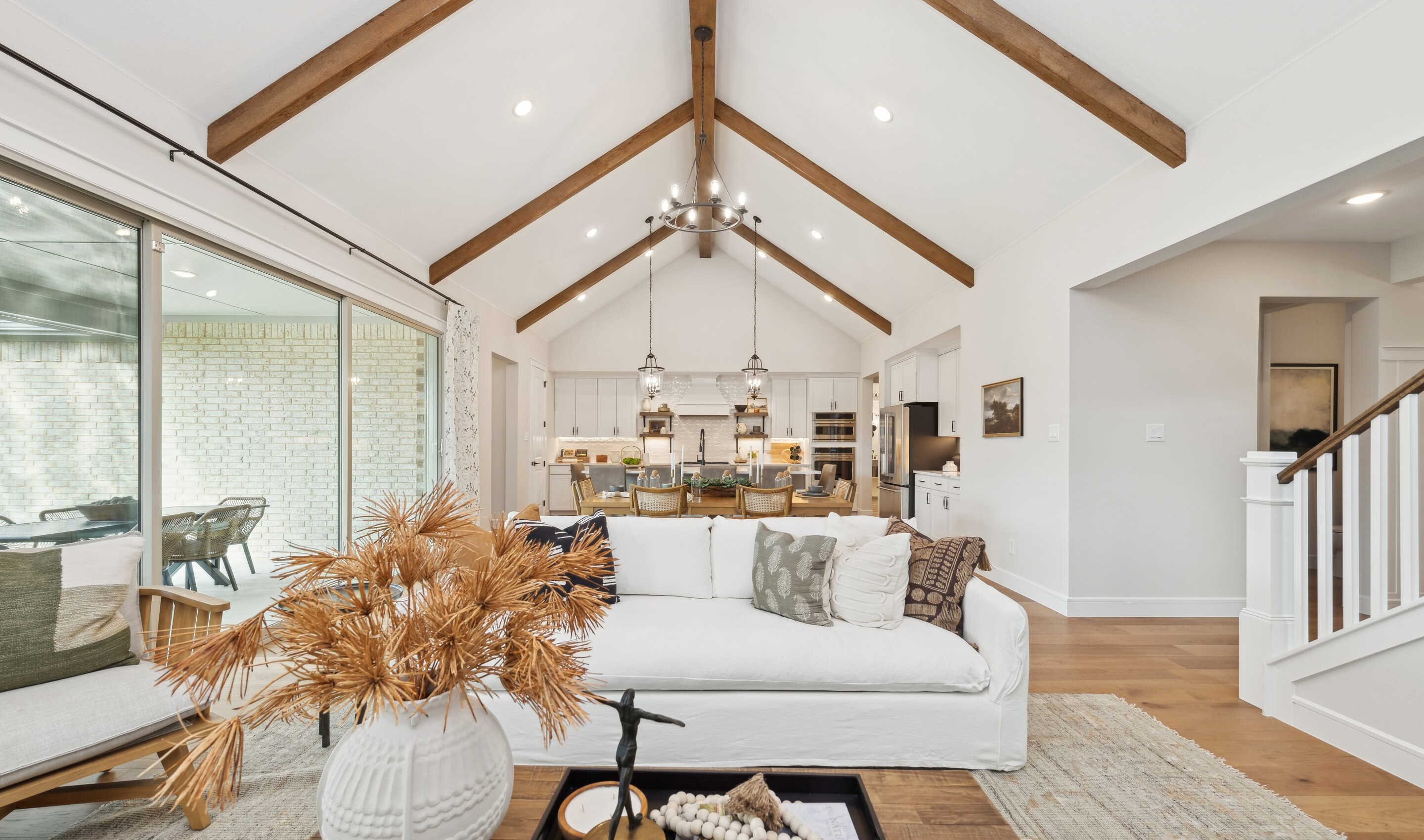 Great room with high ceilings and stained ceiling beams