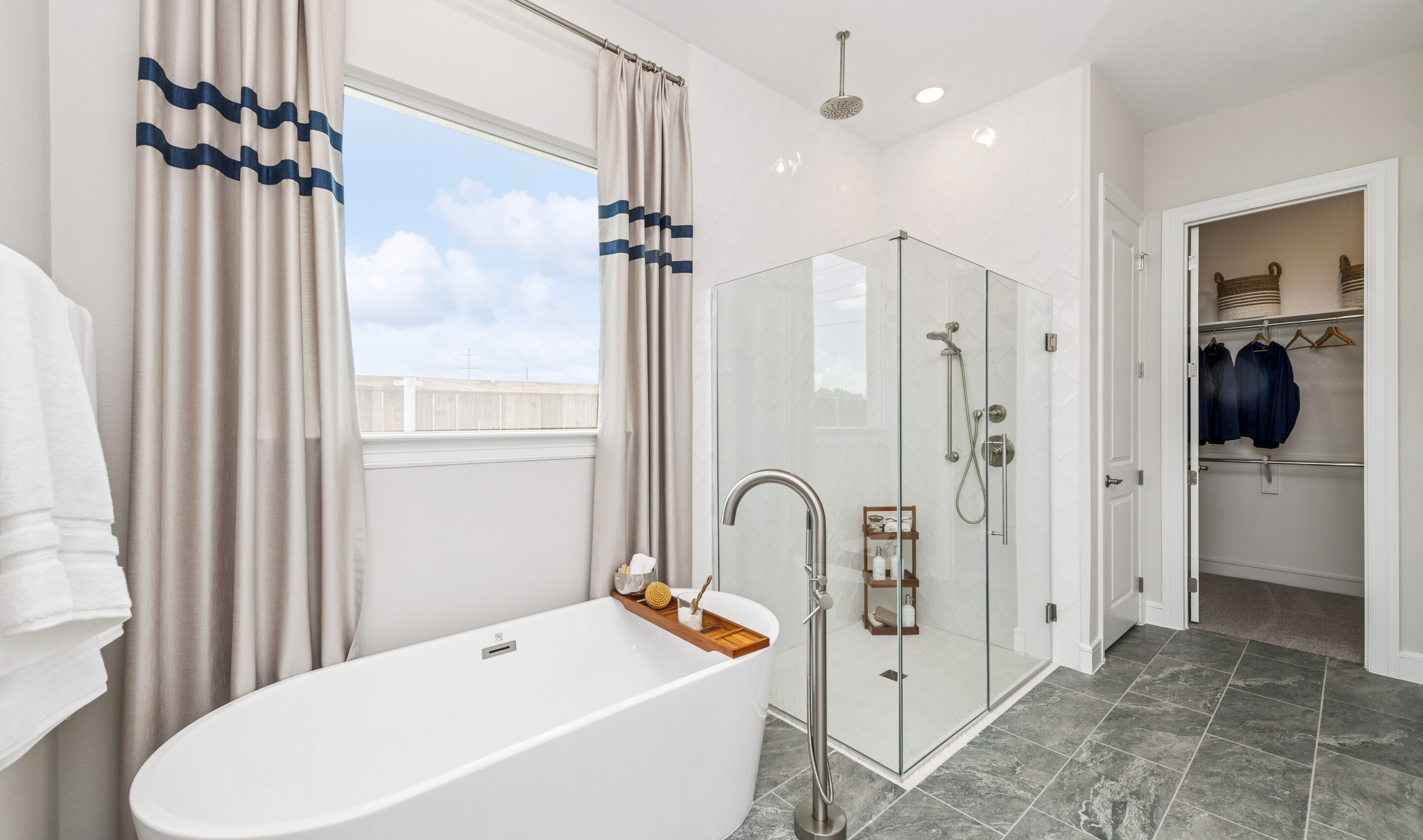 Primary bath with freestanding tub & glass shower enclosure