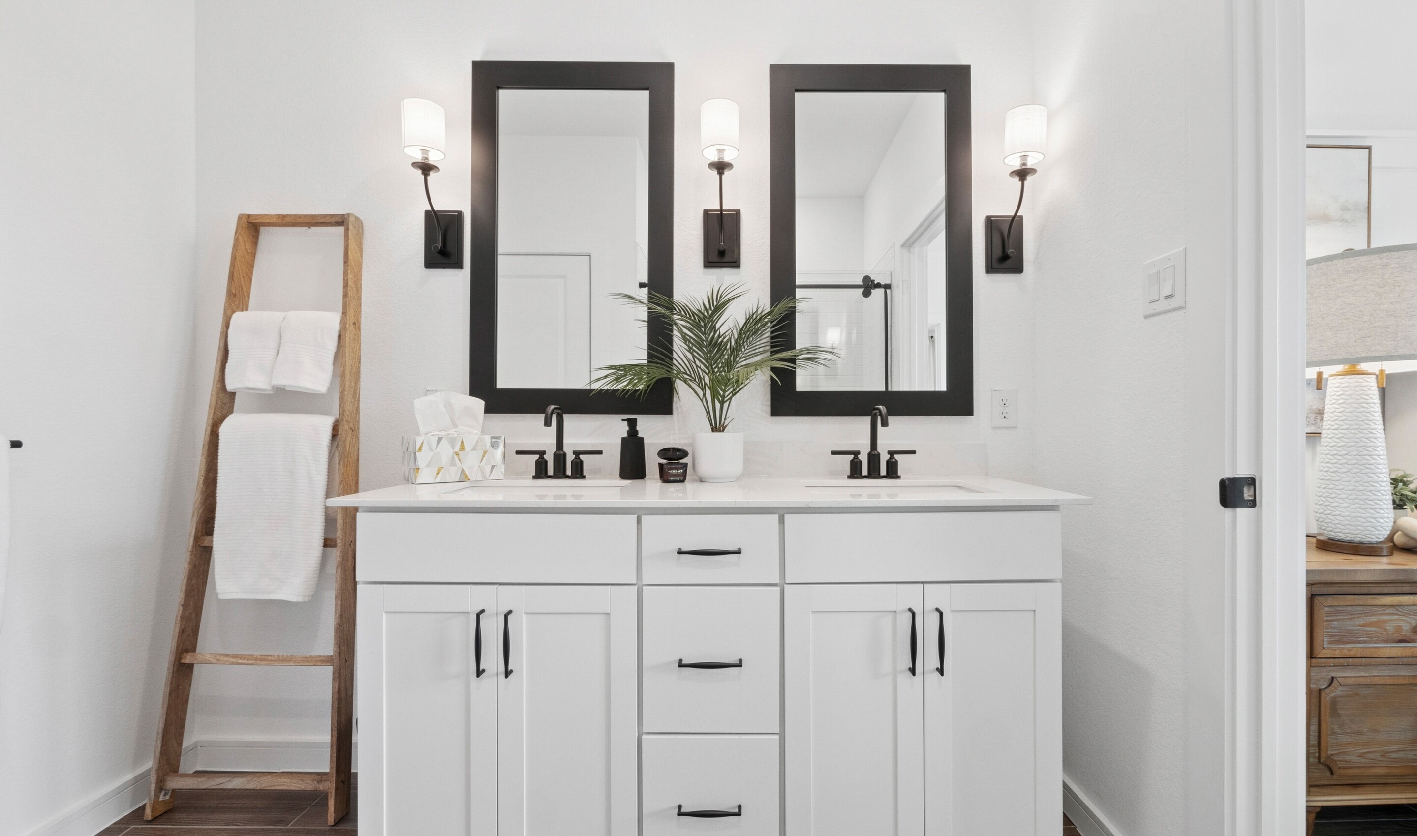 Primary bath features vanity with dual sinks